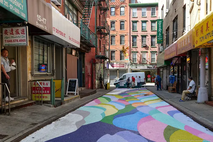an empty Doyers Street with a colorful ground mural in Chinatown in Manhattan